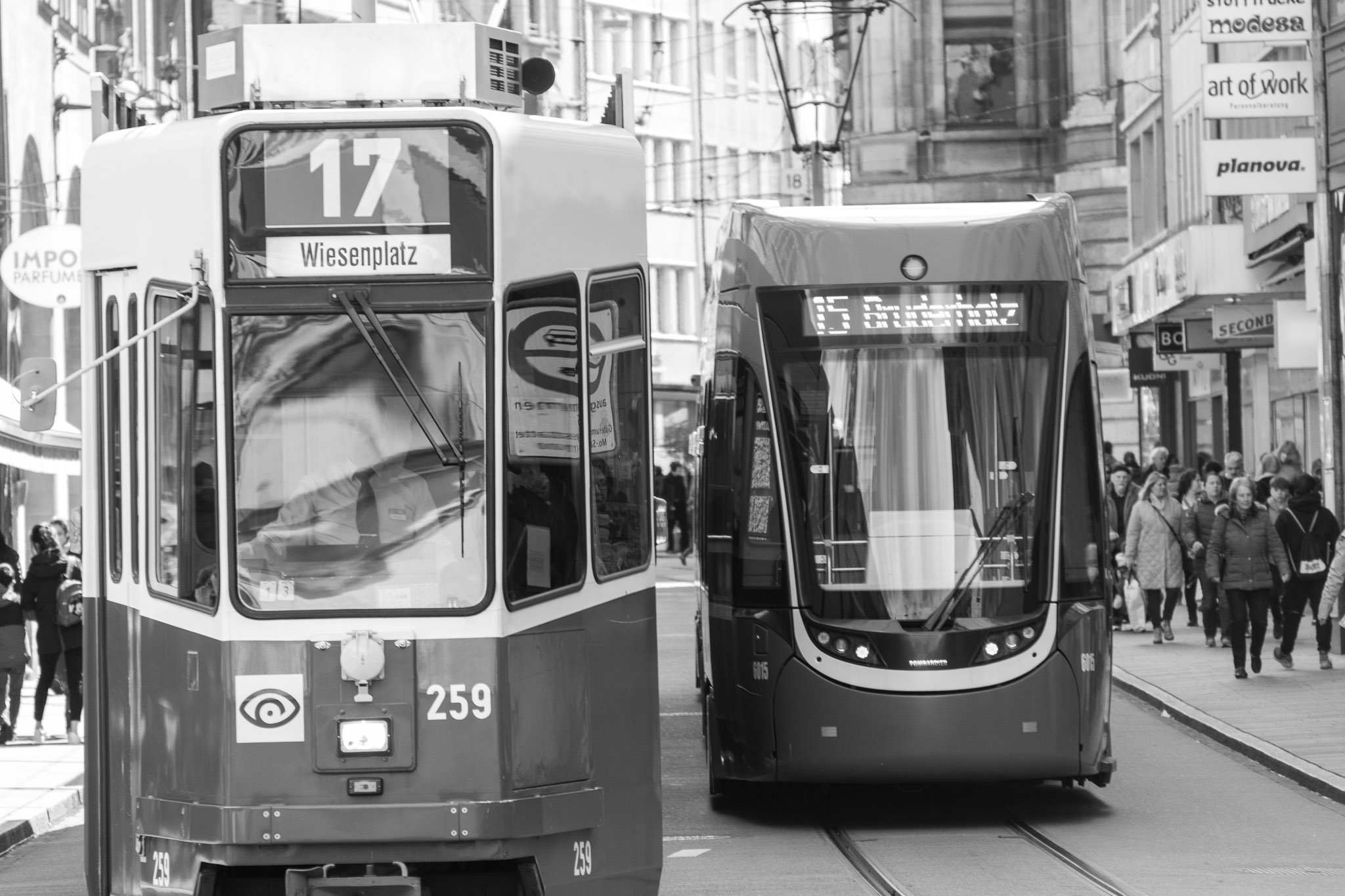 The mechanical pick-ups at the top that run along the overhead wires are called 'Pantographs'